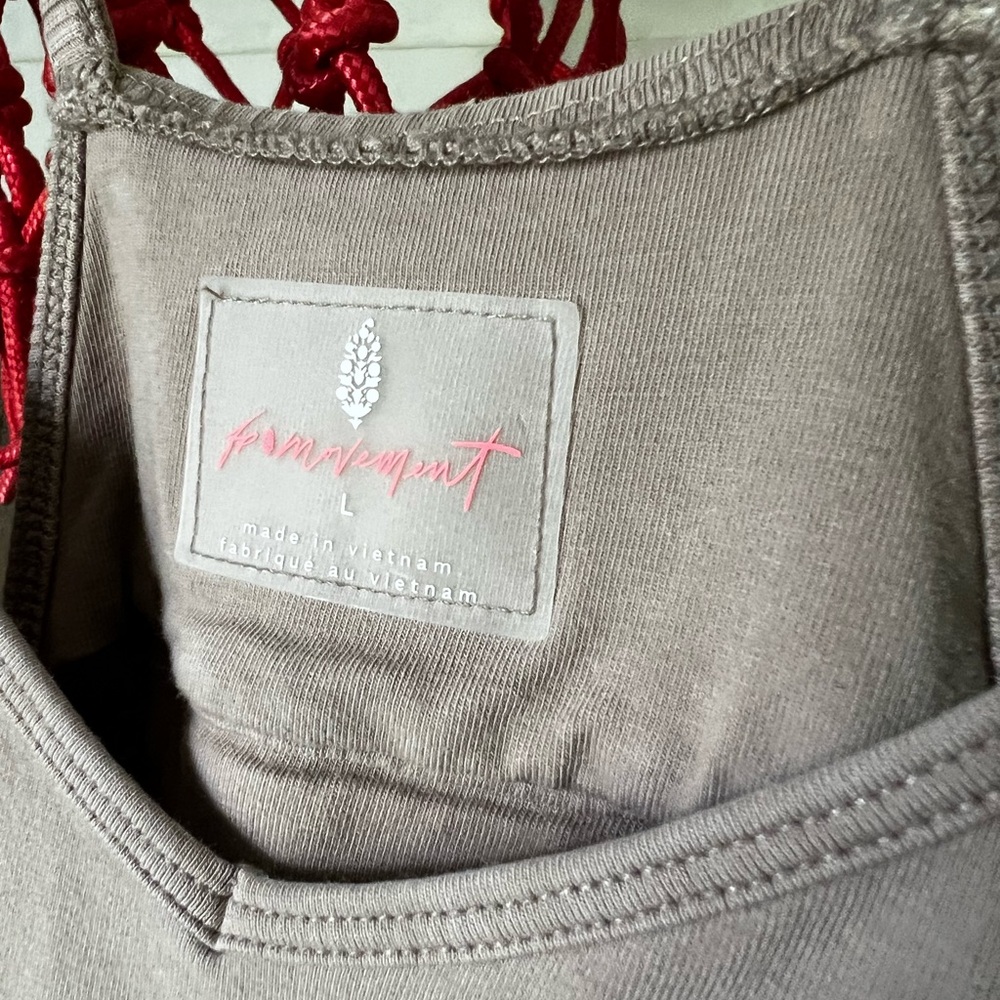 Free People FP Movement Hot Shot Onesie in a tan color, large